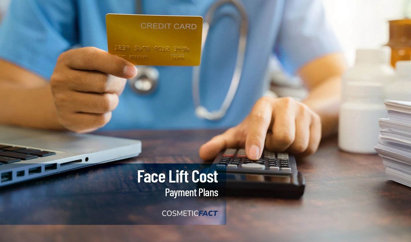 A person holding a calculator and a credit card, exploring facelift surgery financing options.