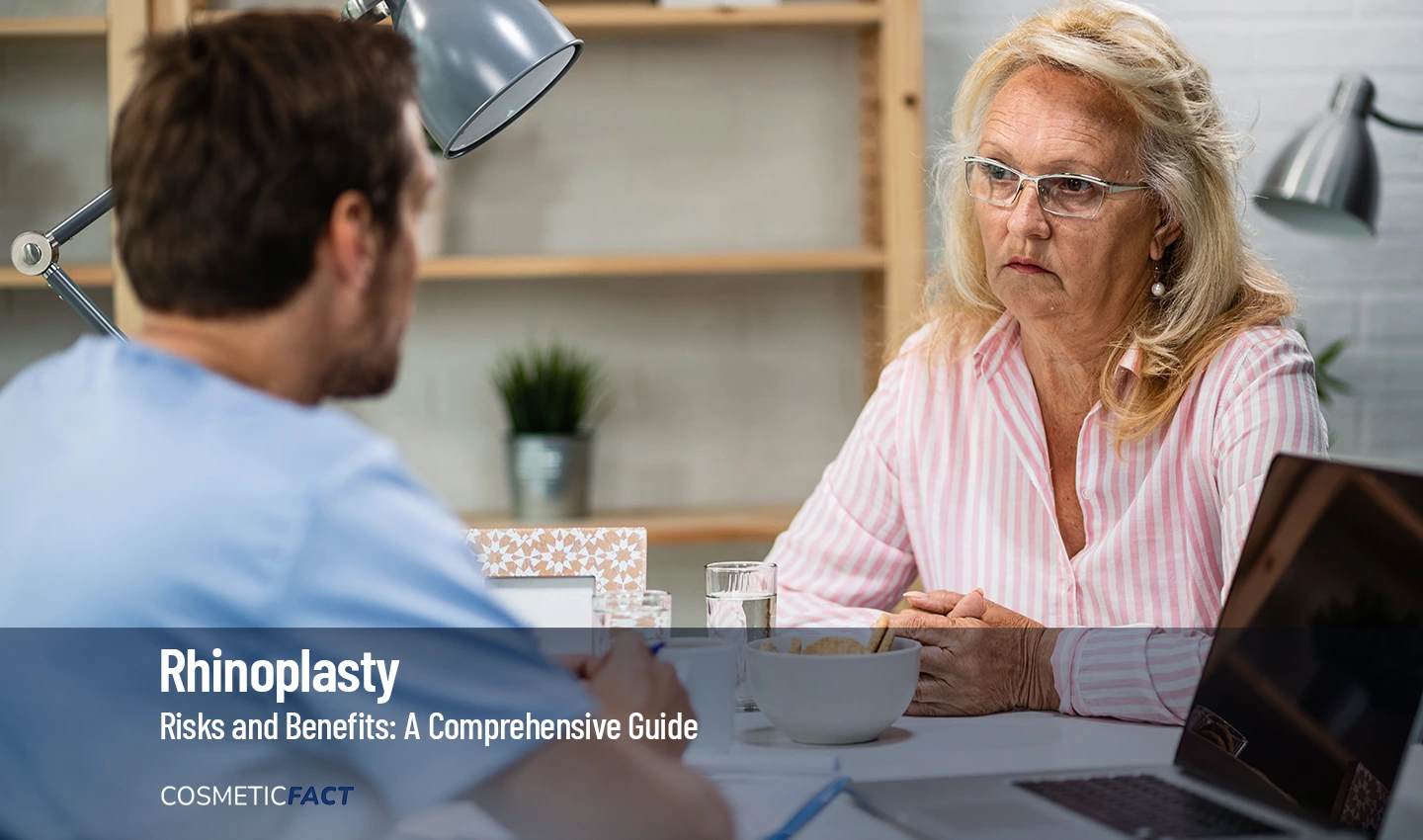 A mature woman having a consultation with a plastic surgeon about the risks and benefits of rhinoplasty.