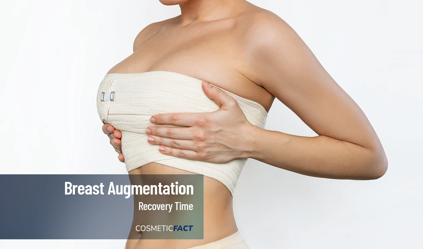 Woman with bandage around her breast during the healing process of breast augmentation recovery.