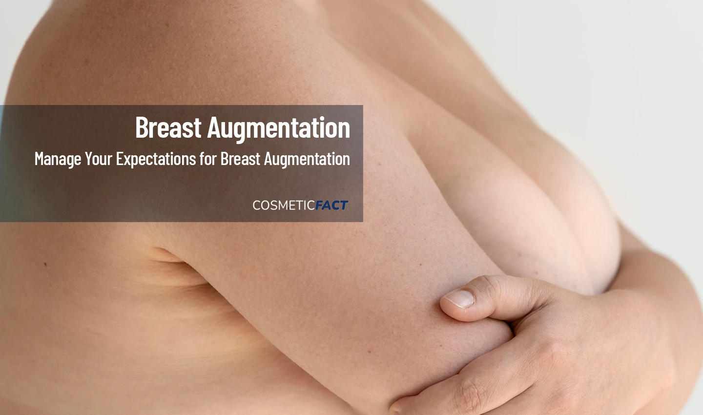 Woman hiding her breasts with her arms, symbolic of the need for realistic expectations in breast augmentation surgery