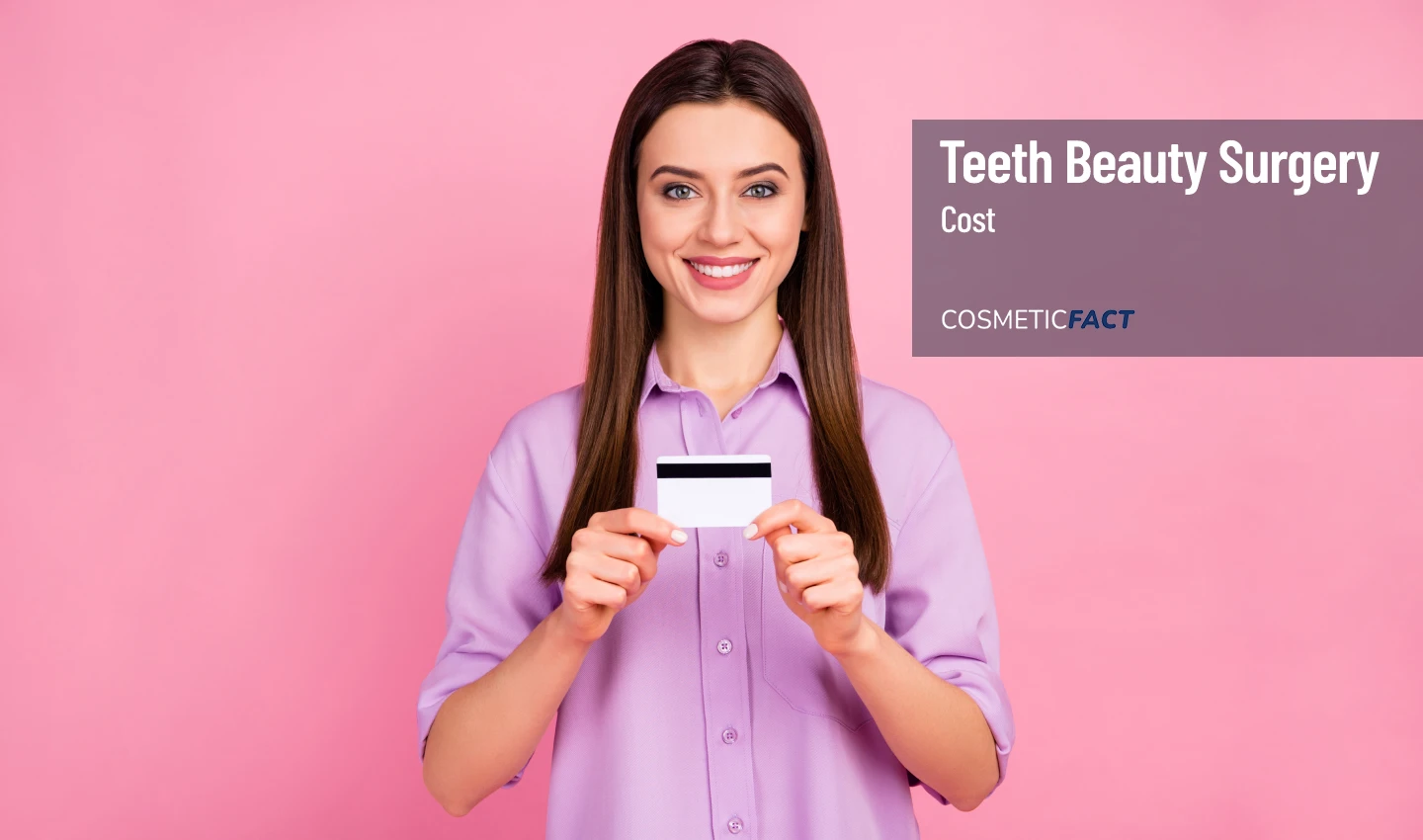 Affordable Cosmetic Dentistry: Smiling woman holding a credit card with noticeably whiter teeth