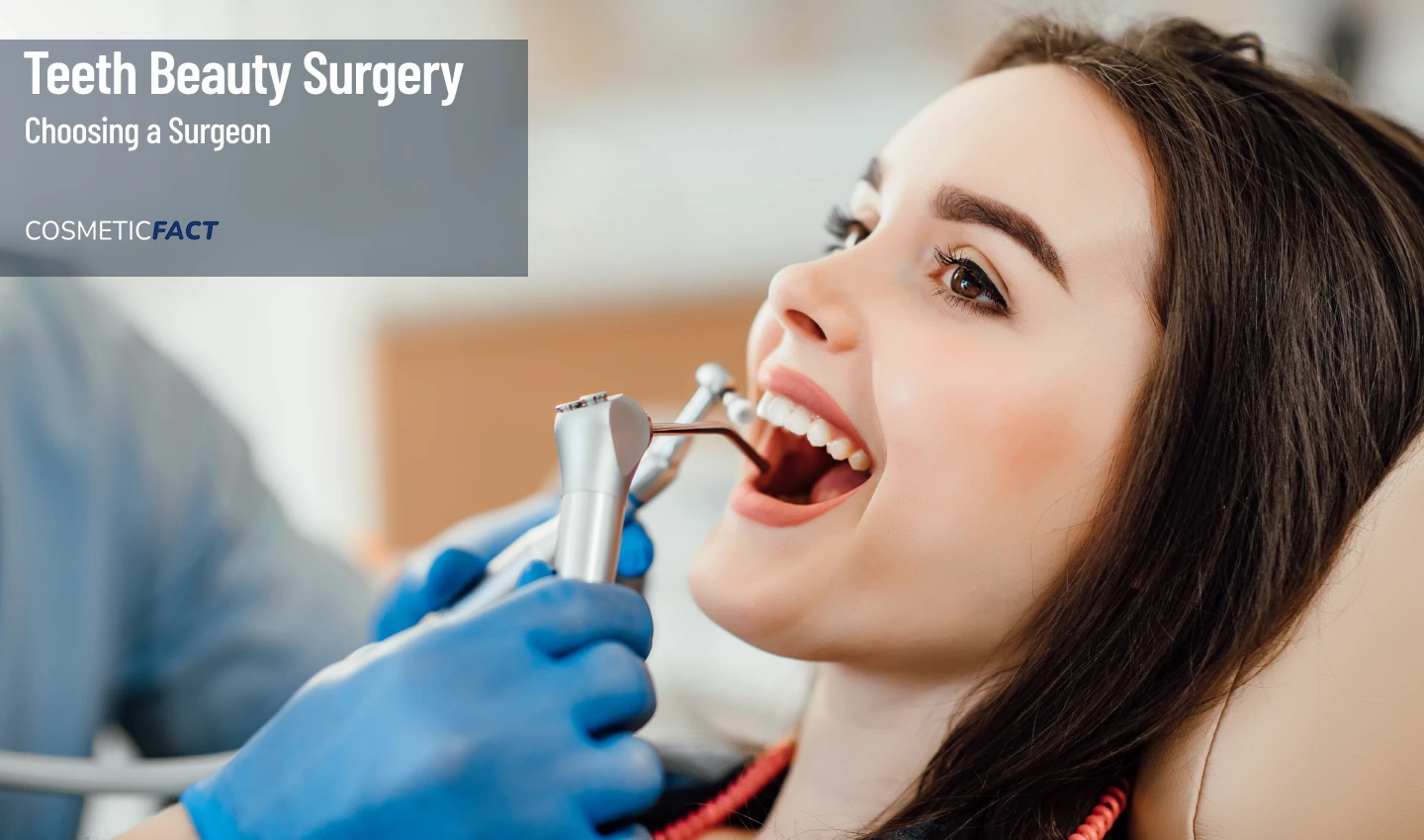 Young woman smiles during teeth beauty surgery performed by a dental surgeon