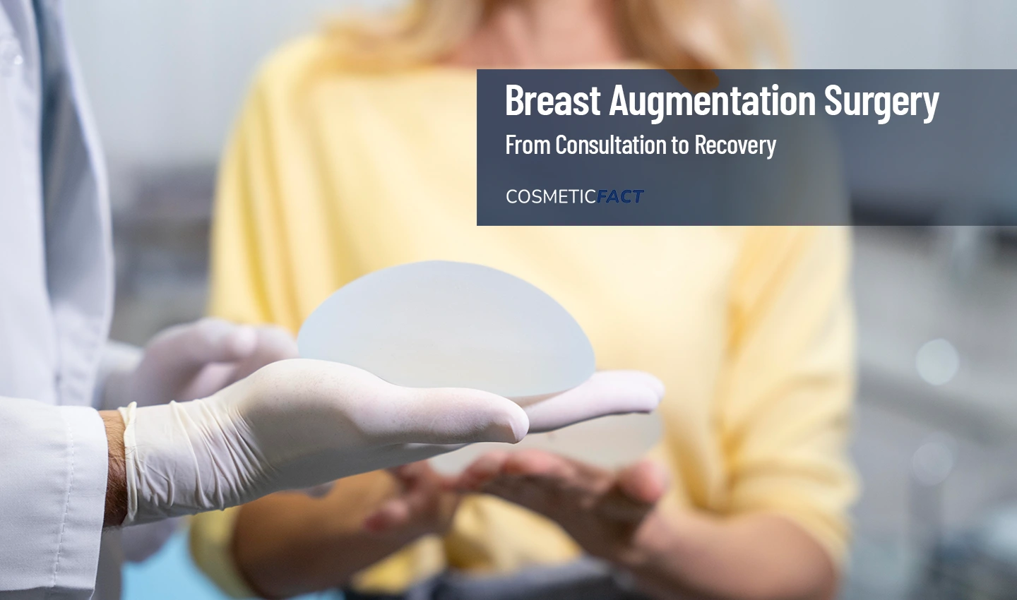 A doctor holding a breast prosthesis while explaining breast augmentation options to a patient.