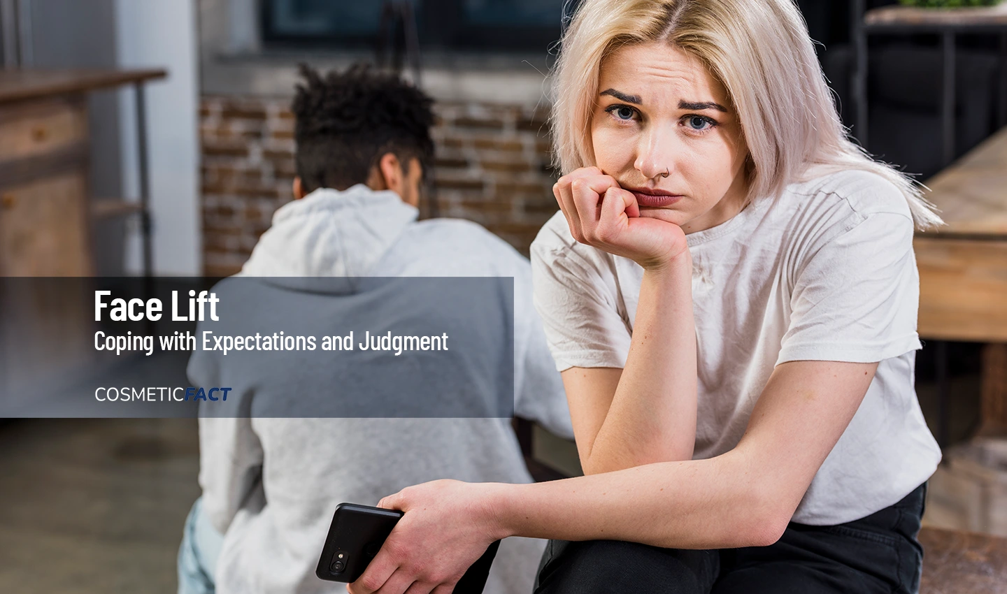 A woman sits upset while a man stands with his back turned in a conversation about coping with societal pressure and facelift surgery expectations.