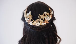 "A woman's hair styled with glamorous hair accessories, including sparkling clips and headbands, perfect for adding shine to any party look