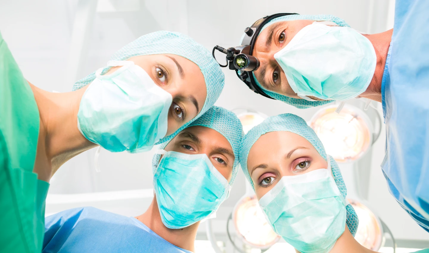 A couple of teeth beauty surgeons in the operation room performing a smile makeover by combining cosmetic dental procedures.