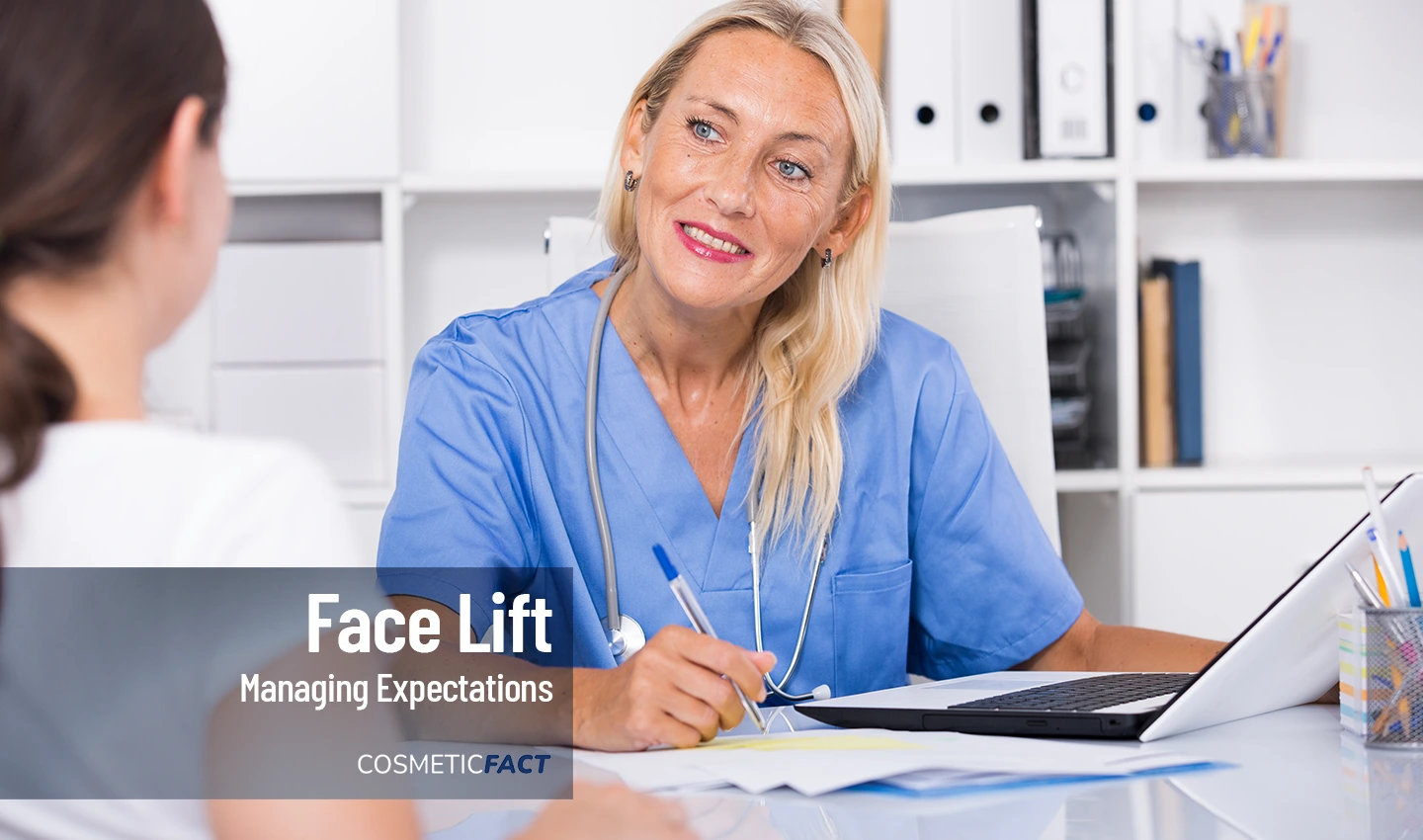 Image of a female plastic surgeon listening to a patient's facelift surgery goals.
