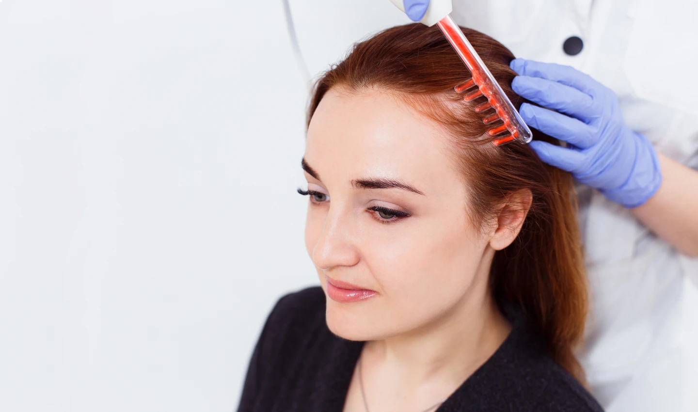 Patient receiving affordable hair restoration treatment, demonstrating cost-effective options for hair loss treatment.