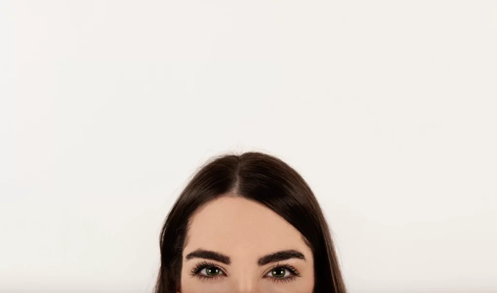 Woman's eyebrow styled with brow gel showcasing benefits of fuller, defined brows.