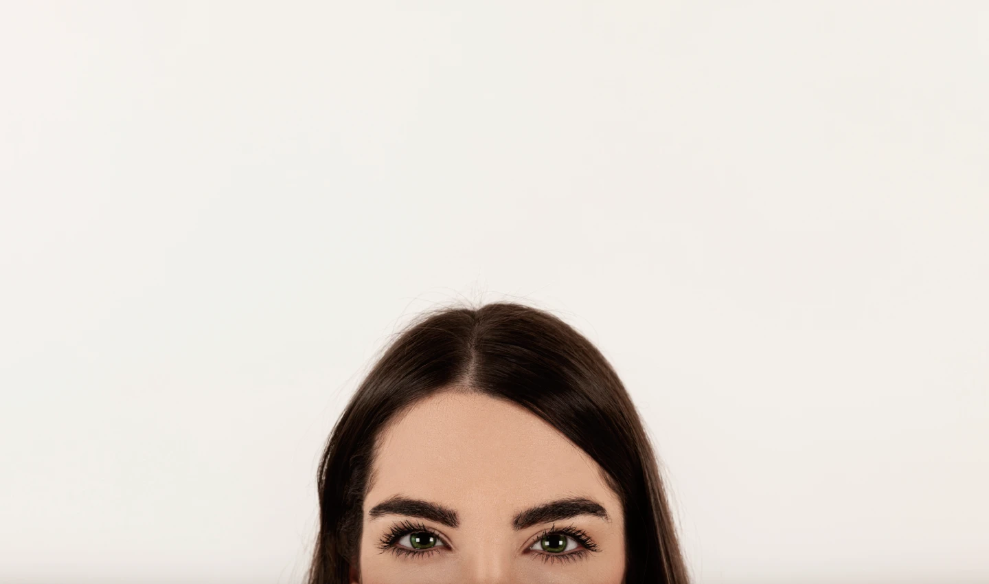 Woman's eyebrow styled with brow gel showcasing benefits of fuller, defined brows.