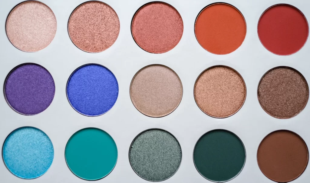A palette of vibrant eye shadow pigments for colorful eye makeup look