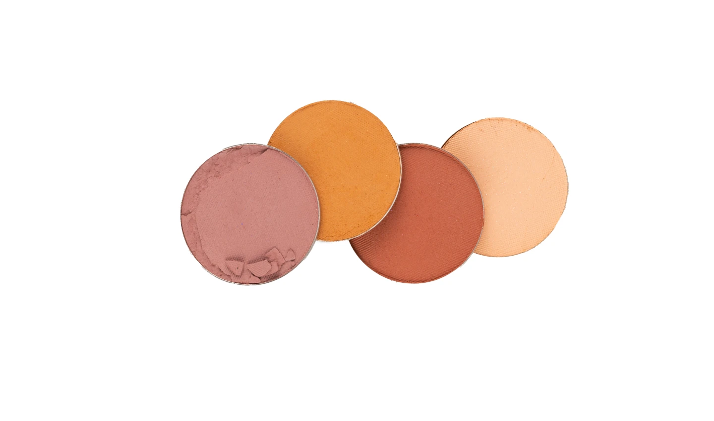 A collection of blushes in various shades, from peach to plum, arranged on a white background.