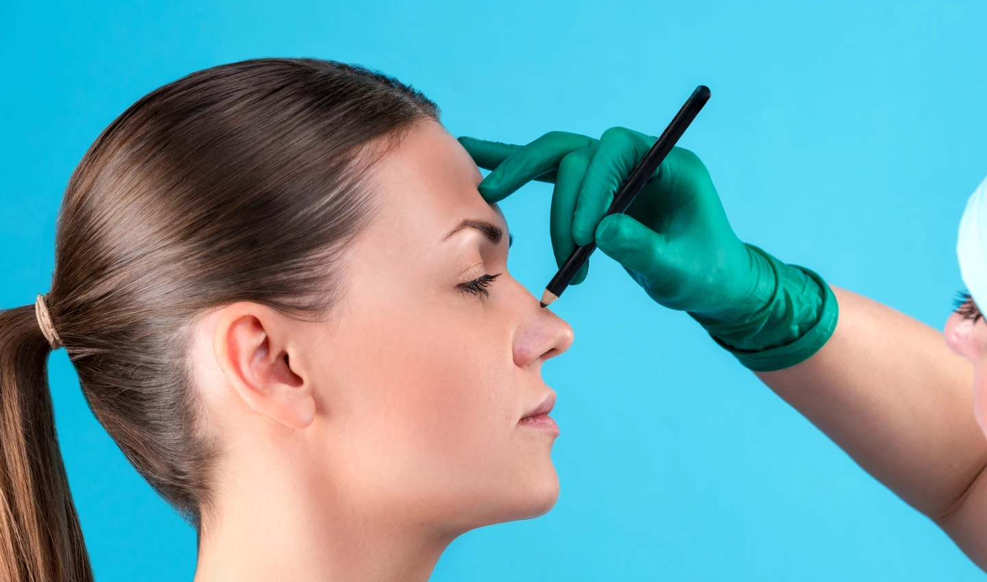 A woman having her nose marked before a non-surgical nose job with dermal fillers.