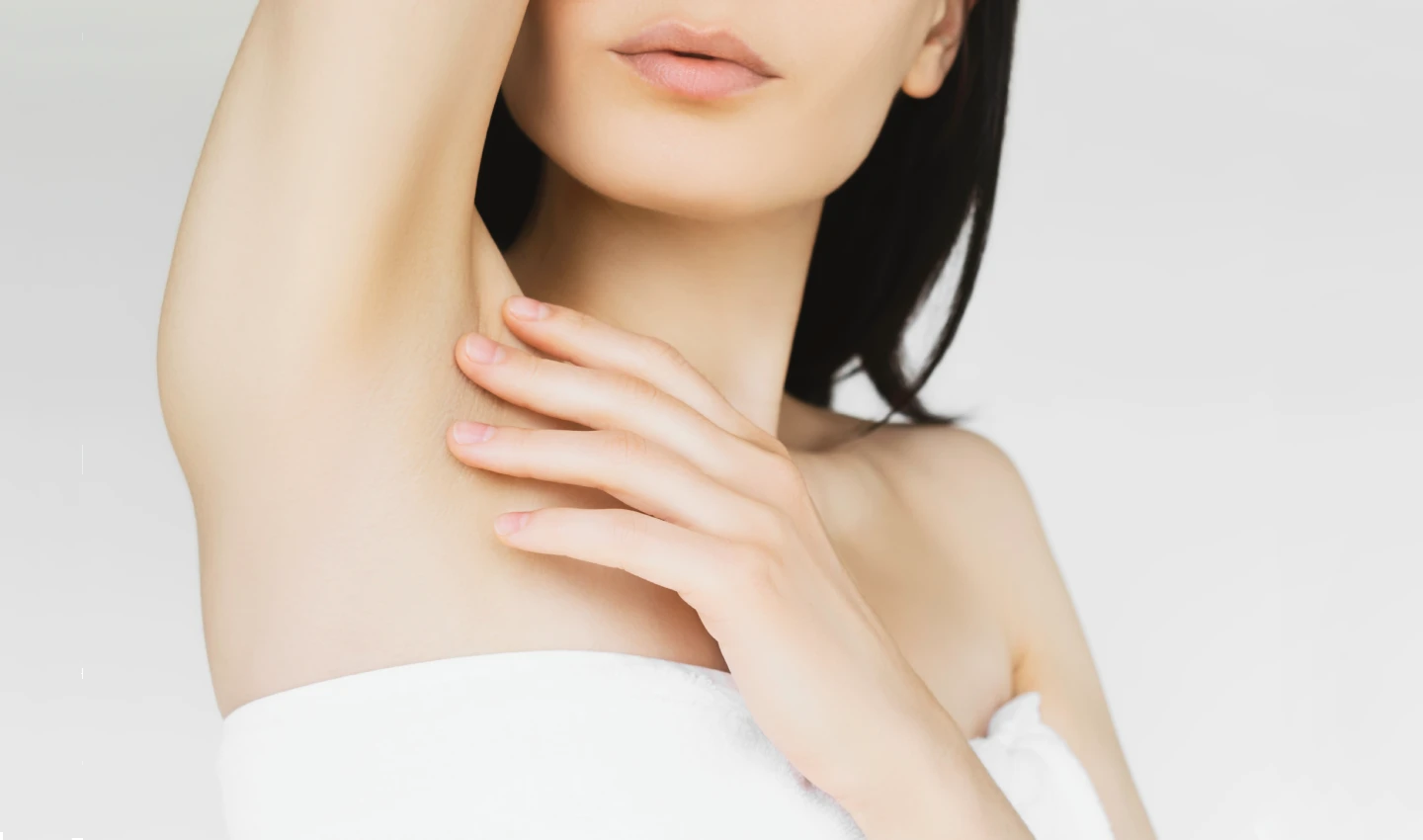 An image of a young woman's shoulder with white and sensitive skin, emphasizing the importance of using appropriate sensitive skin moisturisers.