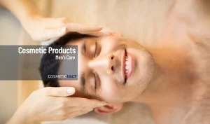 A man getting a facial massage with a smile on his face.