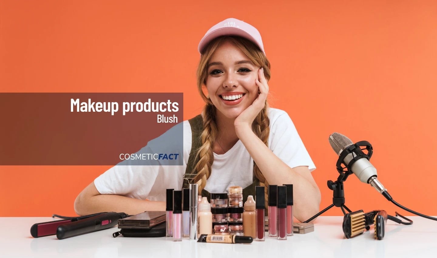 Woman holding a palette of blushes, surrounded by other makeup products, with the text "Blush Palette Reviews" in the foreground.