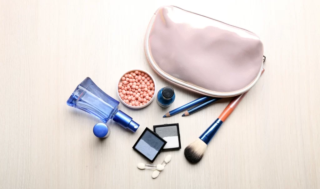 A makeup kit featuring various products and skincare mists, including foundation, eyeliner, mascara, and lipstick. These products can be used together to make your makeup last longer.