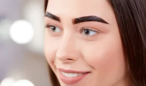 Image of a woman with beautifully microbladed eyebrows, showcasing the transformative power of microblading.