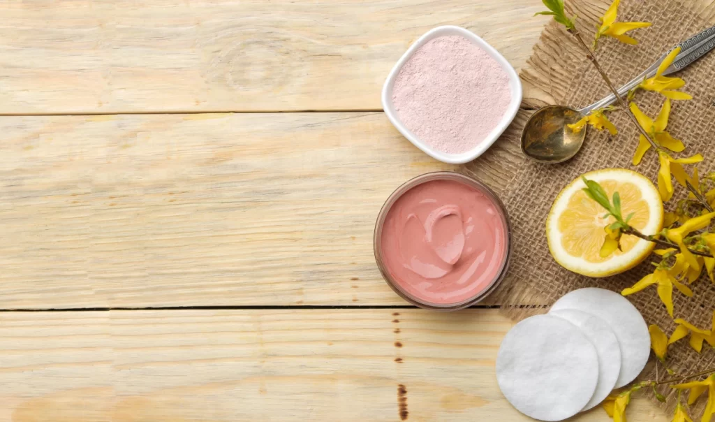 A collection of natural ingredients including sugar, salt, coffee grounds, and oatmeal used in natural scrubs for skin care, highlighting the benefits of using a natural scrub for your skin.