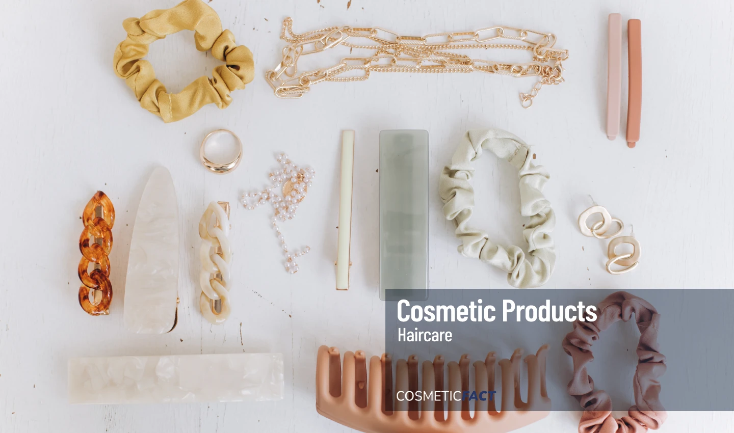 Flat lay view of a collection of fancy and beautiful hair accessories, including hair combs, hairpins, headbands, hair elastics, and hair clips, arranged in a stylish and elegant manner.