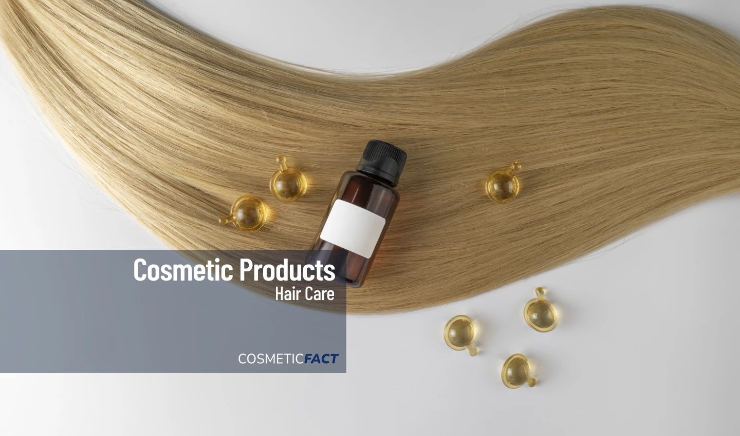 A blonde lock of hair is showcased with hair supplements and a bottle of hair oil, emphasizing the importance of natural ingredients in promoting healthy, beautiful hair.