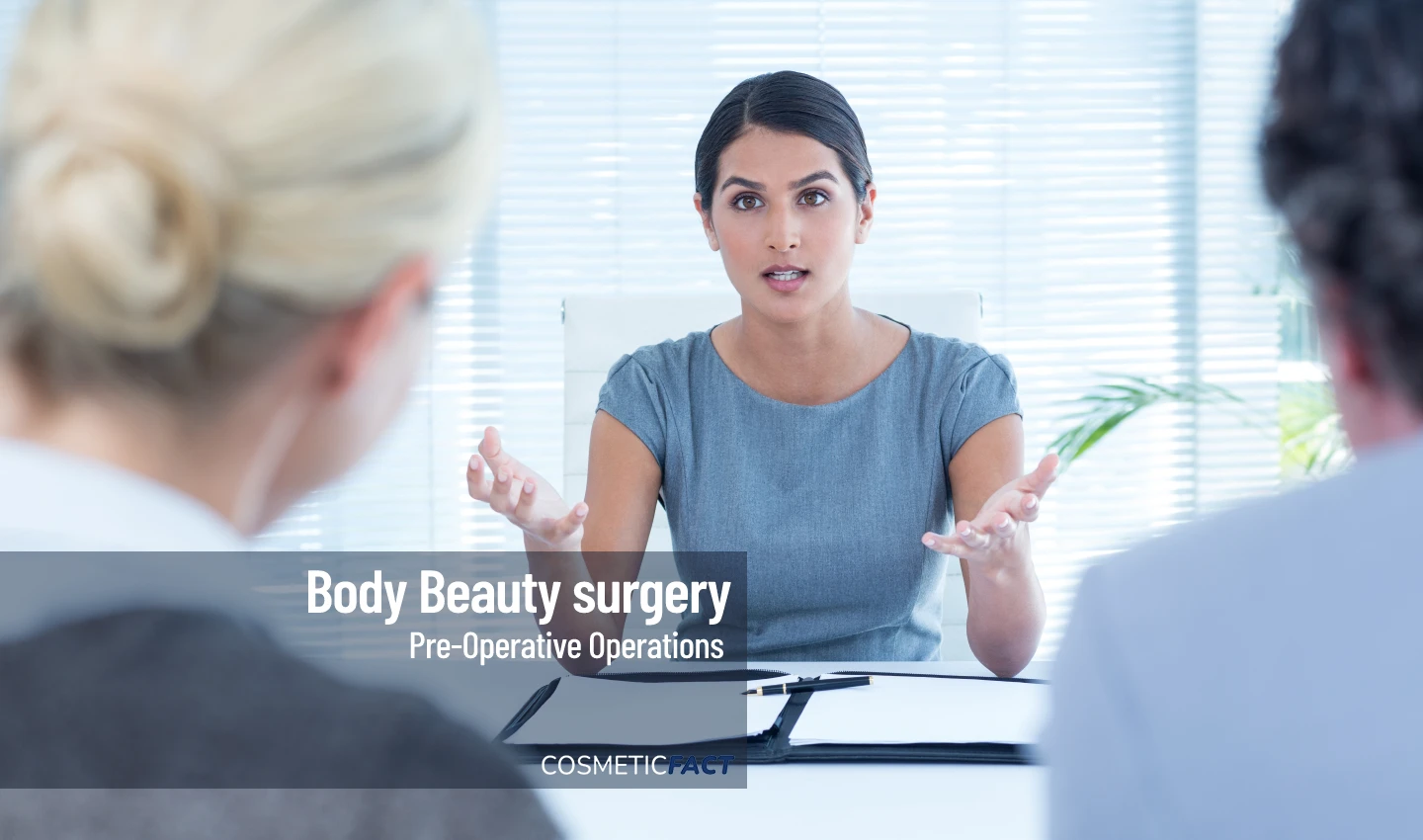 A patient speaks with a surgeon about mental health strategies before undergoing body surgery.