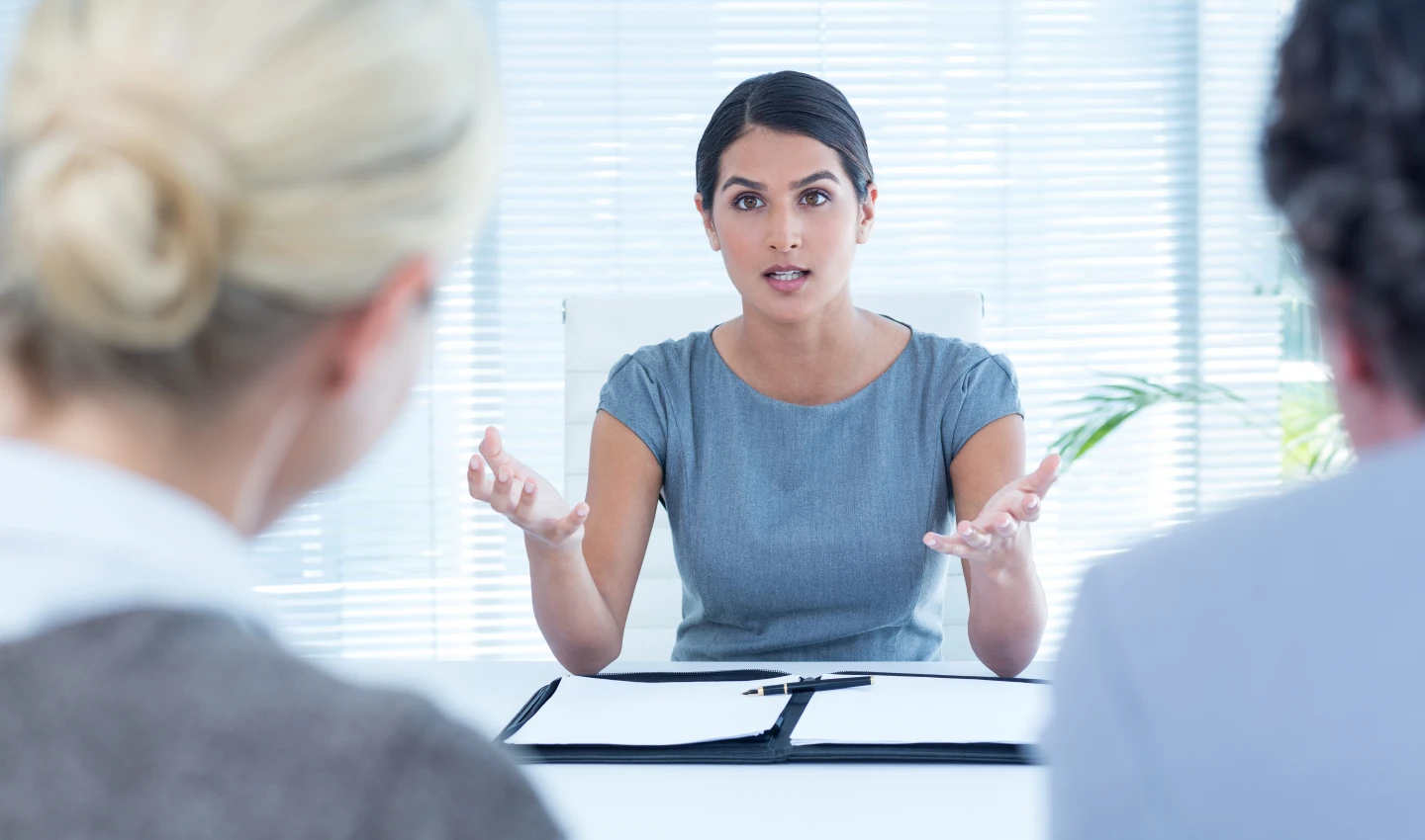 A patient speaks with a surgeon about mental health strategies before undergoing body surgery.