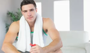 A man holding a towel over his shoulder, showcasing the importance of men's active body care