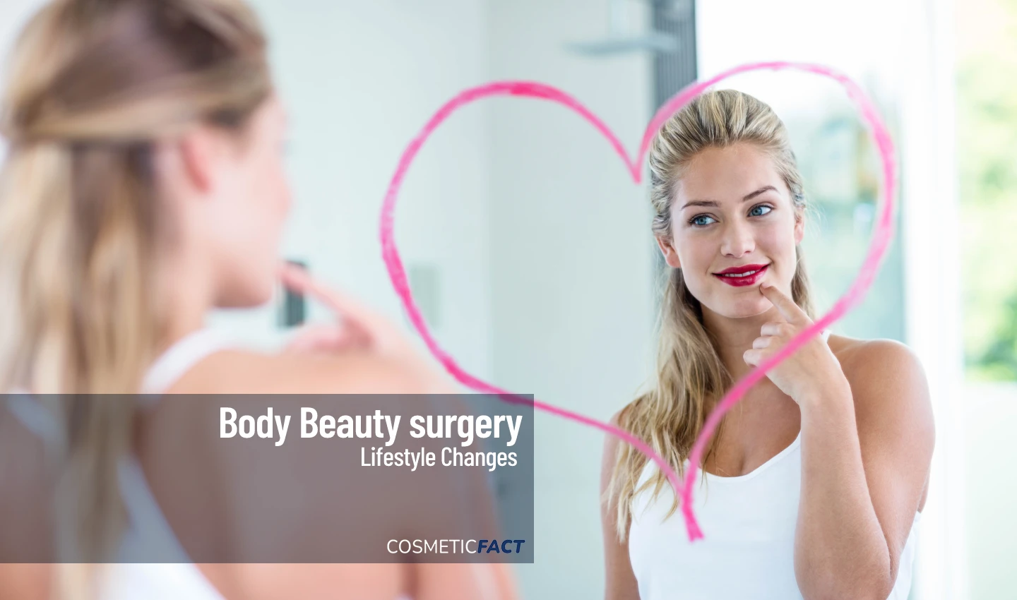 A smiling woman looks at herself in the mirror after body beauty surgery, representing the positive psychological impact of surgery.