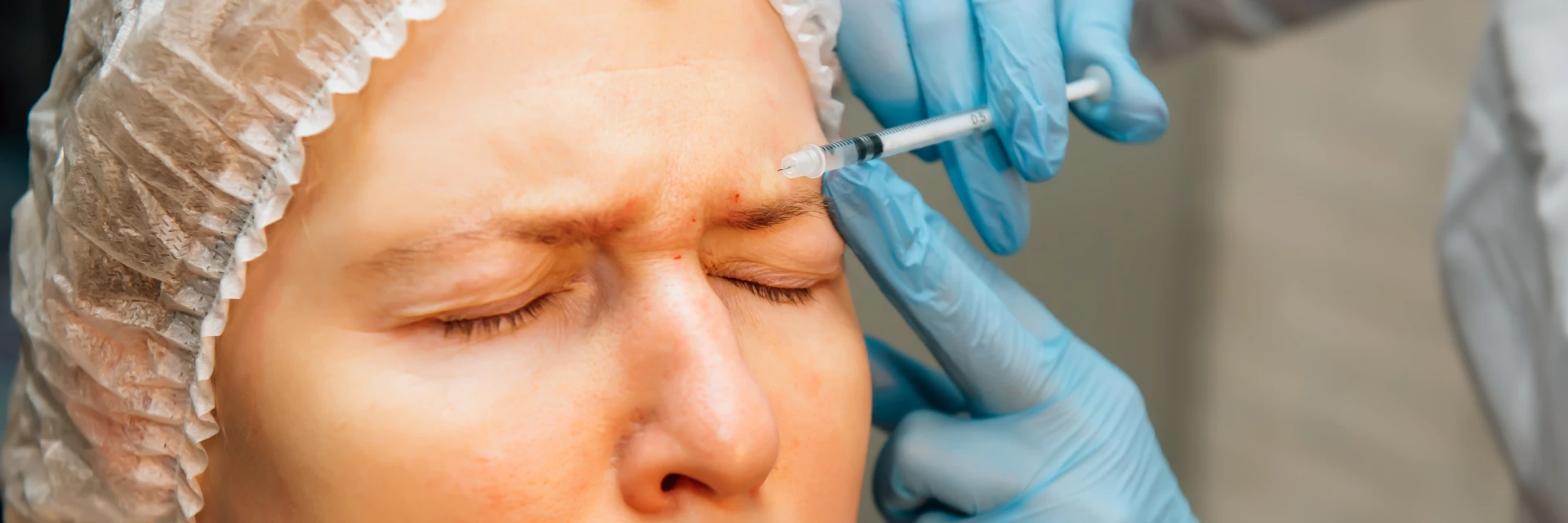 Portrait of a mature woman undergoing a Botox injection