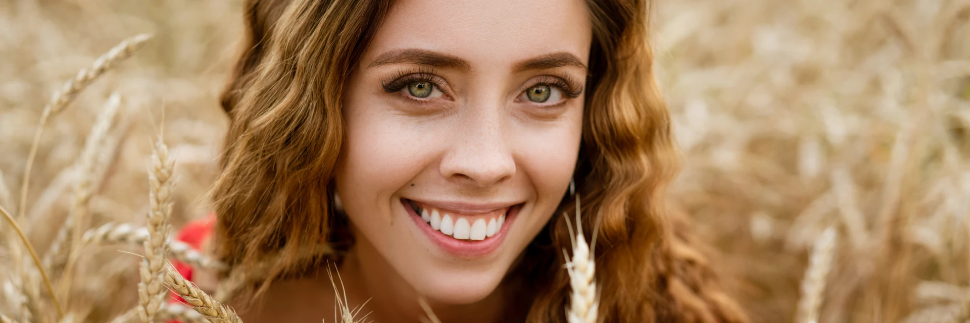 Young woman smiling in natural landscape, representing Teeth Beauty Surgery webpage