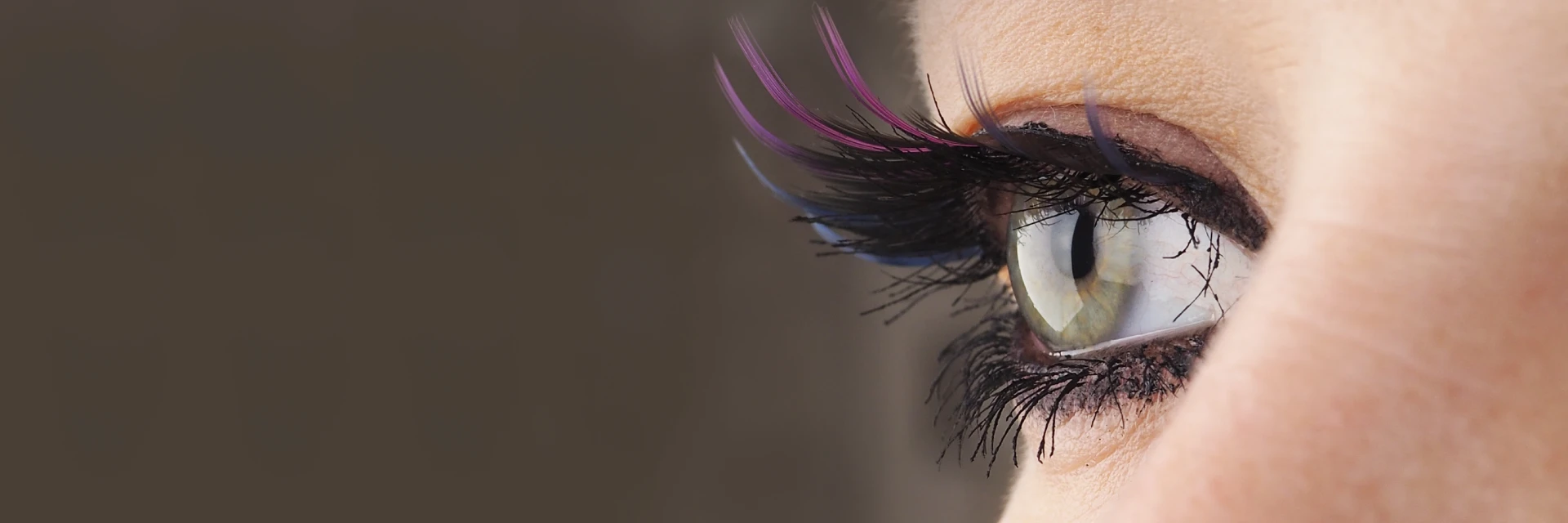 Close-up image of eyes with colorful eyeshadow and mascara