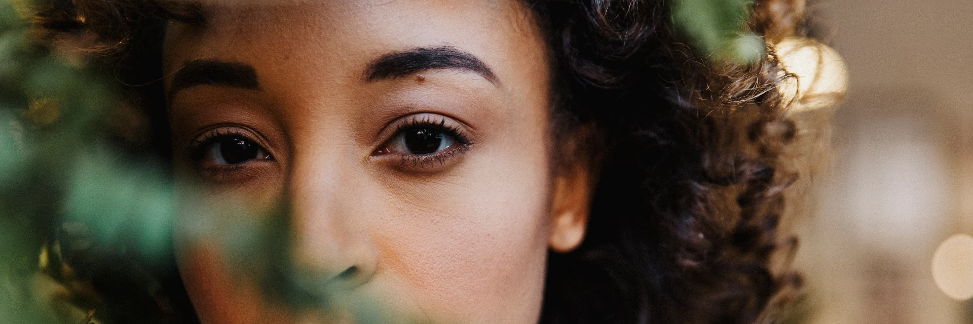 Portrait of a woman with big eyes, representing non-surgical eye treatments webpage