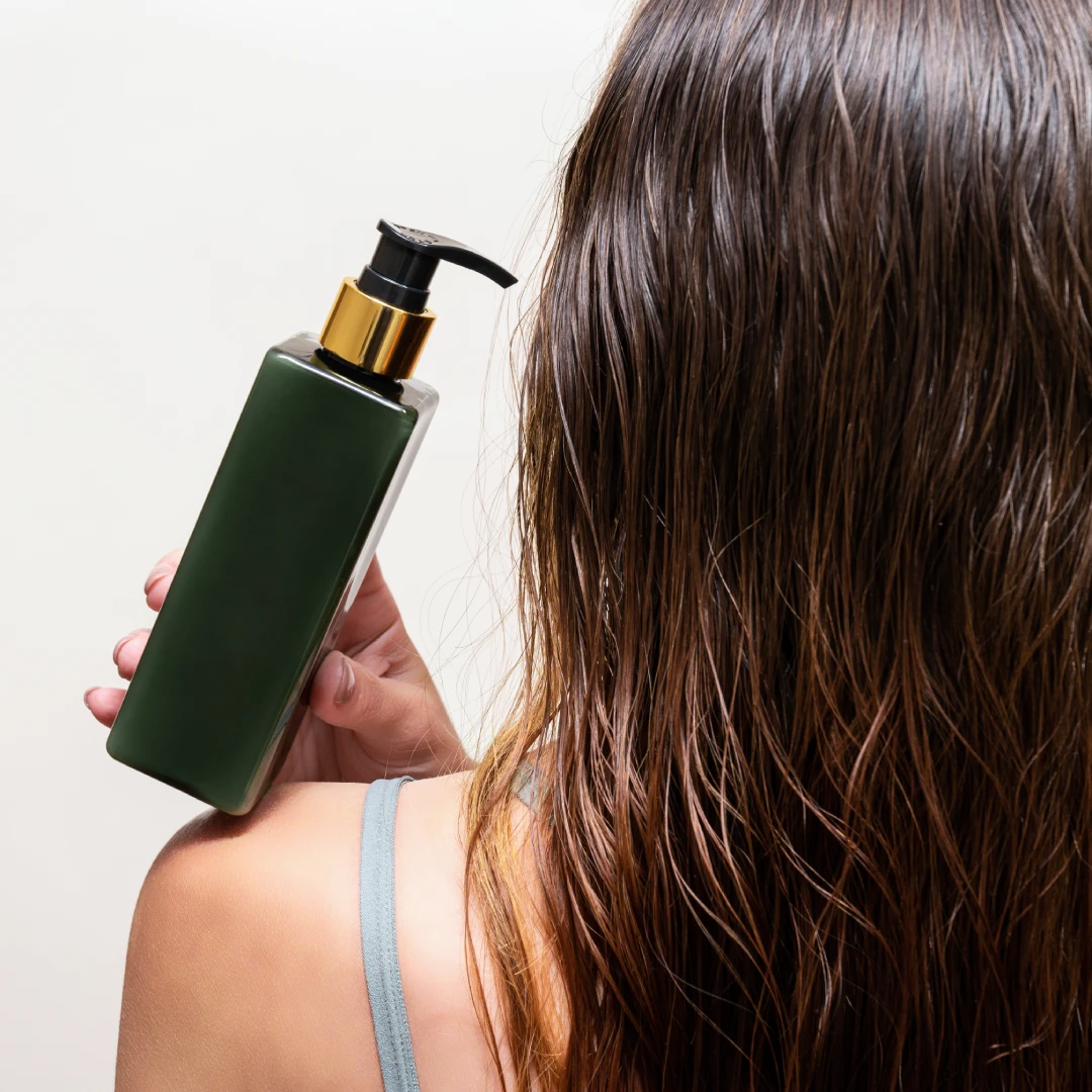 Woman holding a hair treatment product