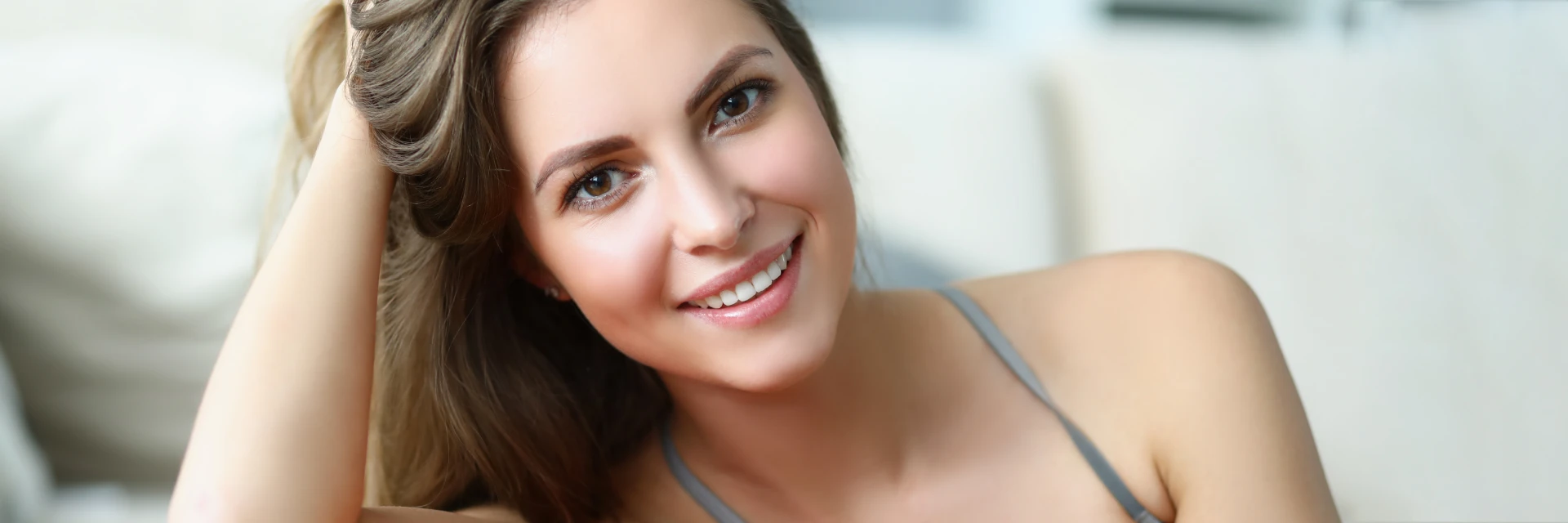 Young woman with a beautiful smile representing non-surgical lips treatments webpage