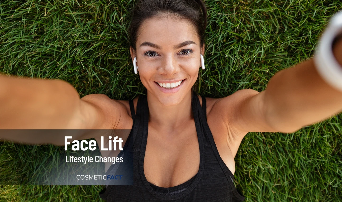An athletic woman lying on the grass and smiling, symbolizing the positive outcome of lifestyle changes made in preparation for facelift surgery.An athletic woman lying on the grass and smiling, symbolizing the positive outcome of lifestyle changes made in preparation for facelift surgery.