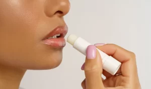 Unfading Lipstick Glamour - African Woman Applies Hygienic Balsam Lipstick