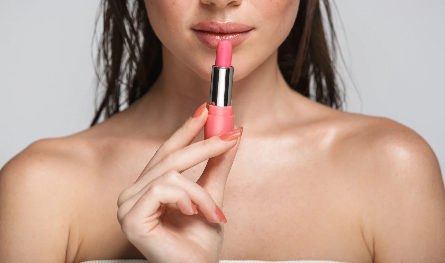 Hydrating Lipsticks: Beauty Half Face Portrait of an Attractive Sensual Young Woman with Wet Brunette Long Hair