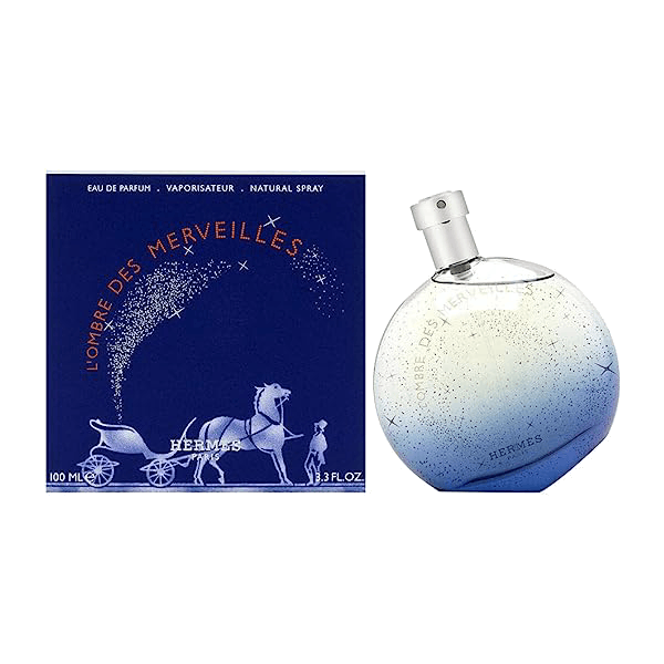 Elegant bottle of Hermès L’Ombre Des Merveilles perfume reflecting a cosmos theme