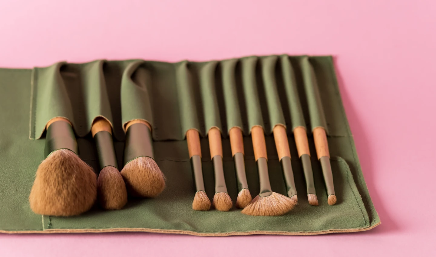 Vegan Makeup Brushes Set of Brushes Powder Foundation on Pink Background