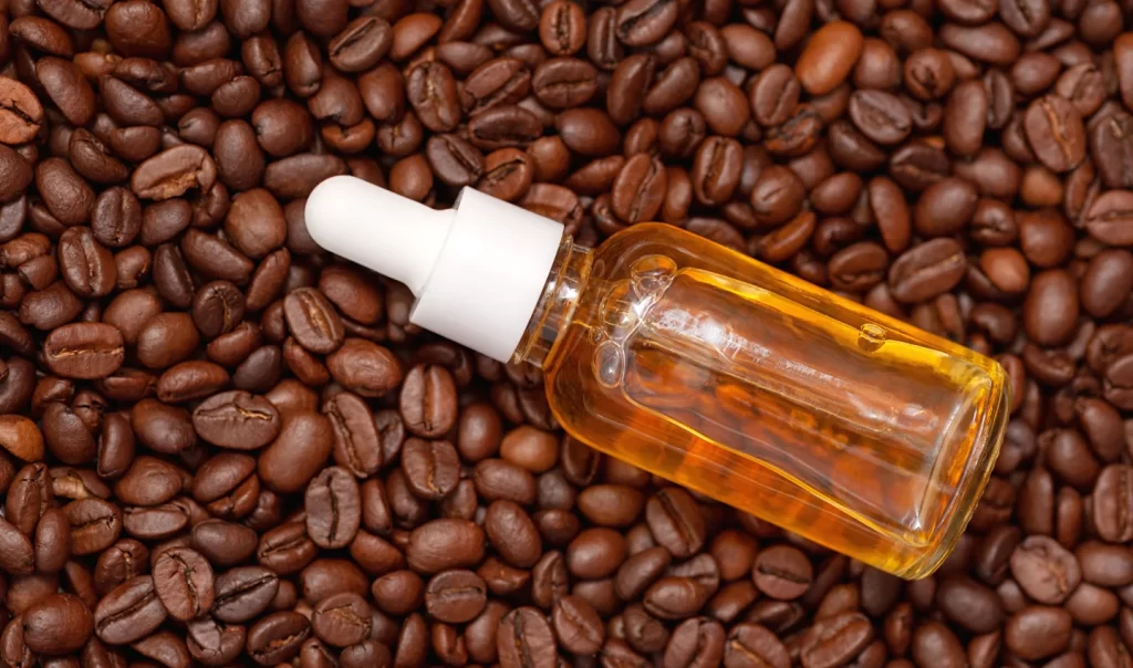 Caffeine Eye Serums - Glass Bottle with Coffee Essential Oil and Coffee Beans