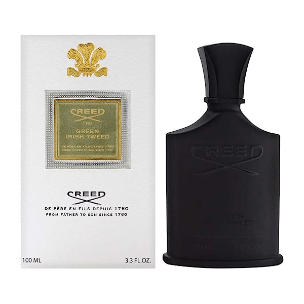 Creed Green Irish Tweed perfume in its distinctive dark green bottle, embossed with the iconic Creed emblem
