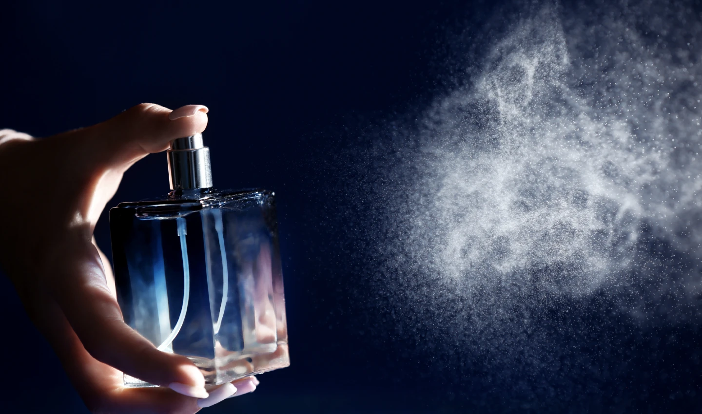 An illustration of a perfume bottle spraying, capturing the essence of scent diffusion as part of the Ultimate Perfume Guide