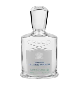 Bottle of Creed's Virgin Island Water perfume against a tropical backdrop