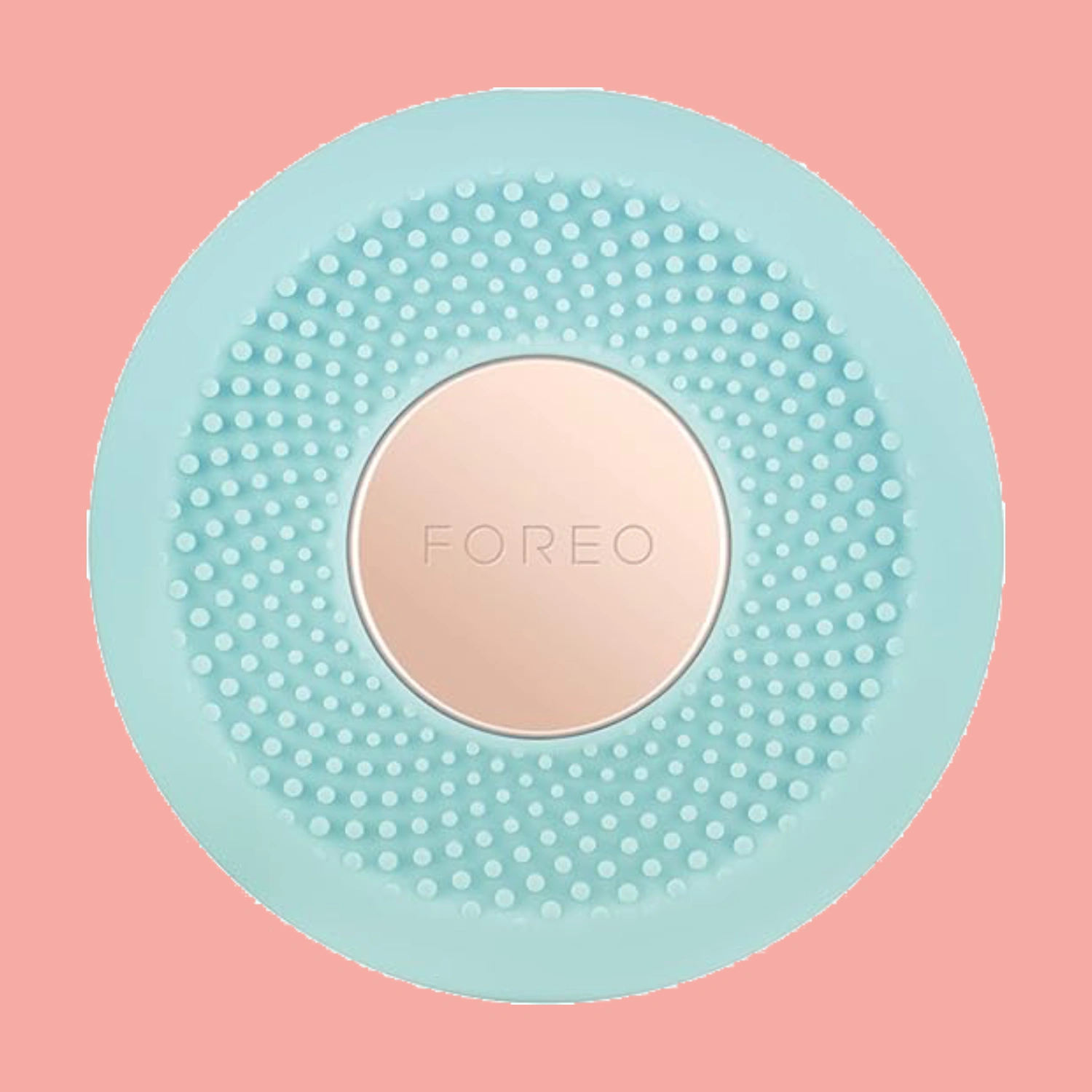 Foreo UFO device on a pink background various LED lights, for a personalized skincare treatment.