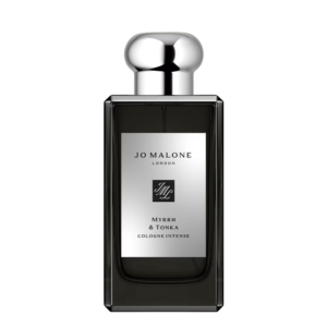 A bottle of Tauer Perfumes L'Air du Désert Marocain displayed against an exotic Moroccan-inspired backdrop