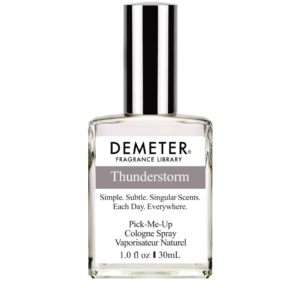 ThunderstormCologneSpray bottle elegantly displayed against a backdrop of forest foliage, signifying its woody and aquatic scent profile