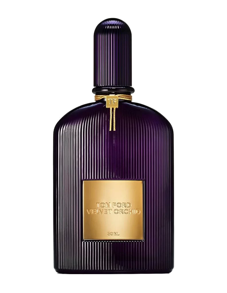 Tom Ford Velvet Orchid EDP in a dark plum-colored glass bottle with a golden plate, displayed on a vanity.