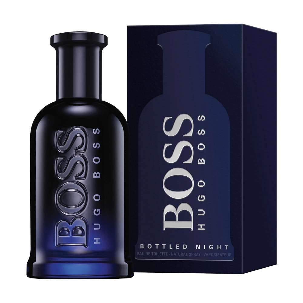 A sleek bottle of Boss Bottled Night on a dark wooden surface, highlighting its modern and sophisticated design.