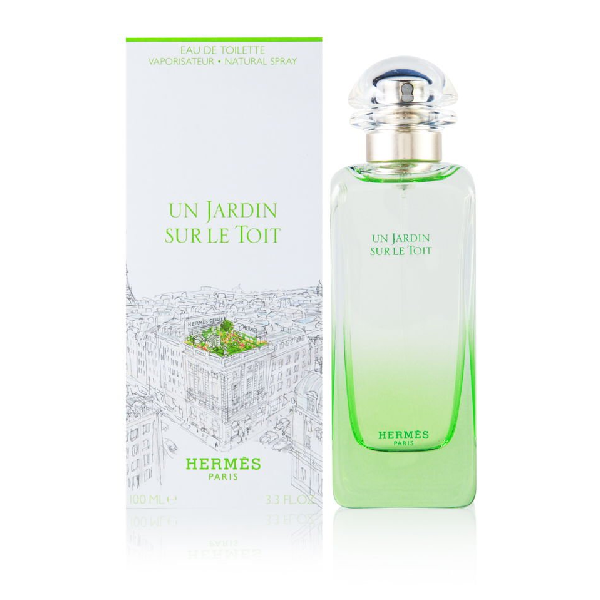 Hermes Un Jardin sur le Toit Perfume Bottle against a garden backdrop